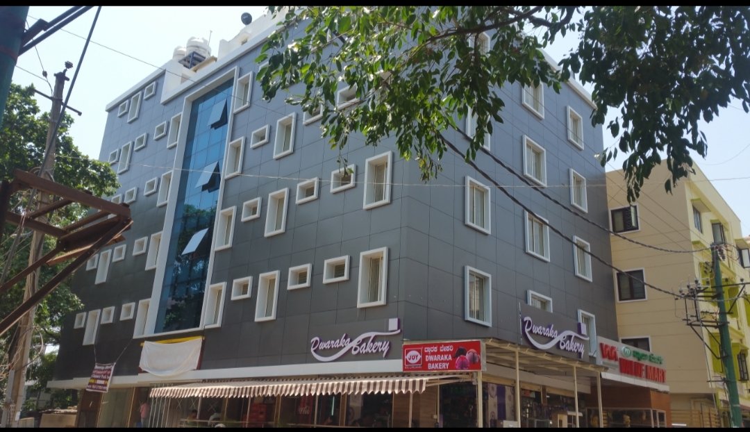Contemporary Office Building Facade, exterior works by Dhrithi Infra