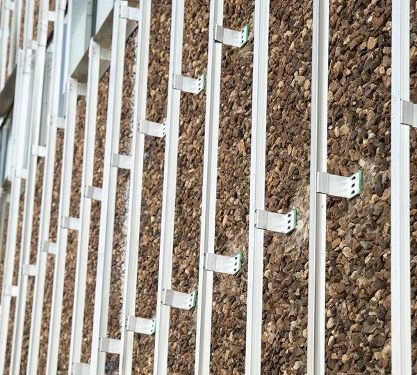 Aluminium and MS framing grid set out on a facade