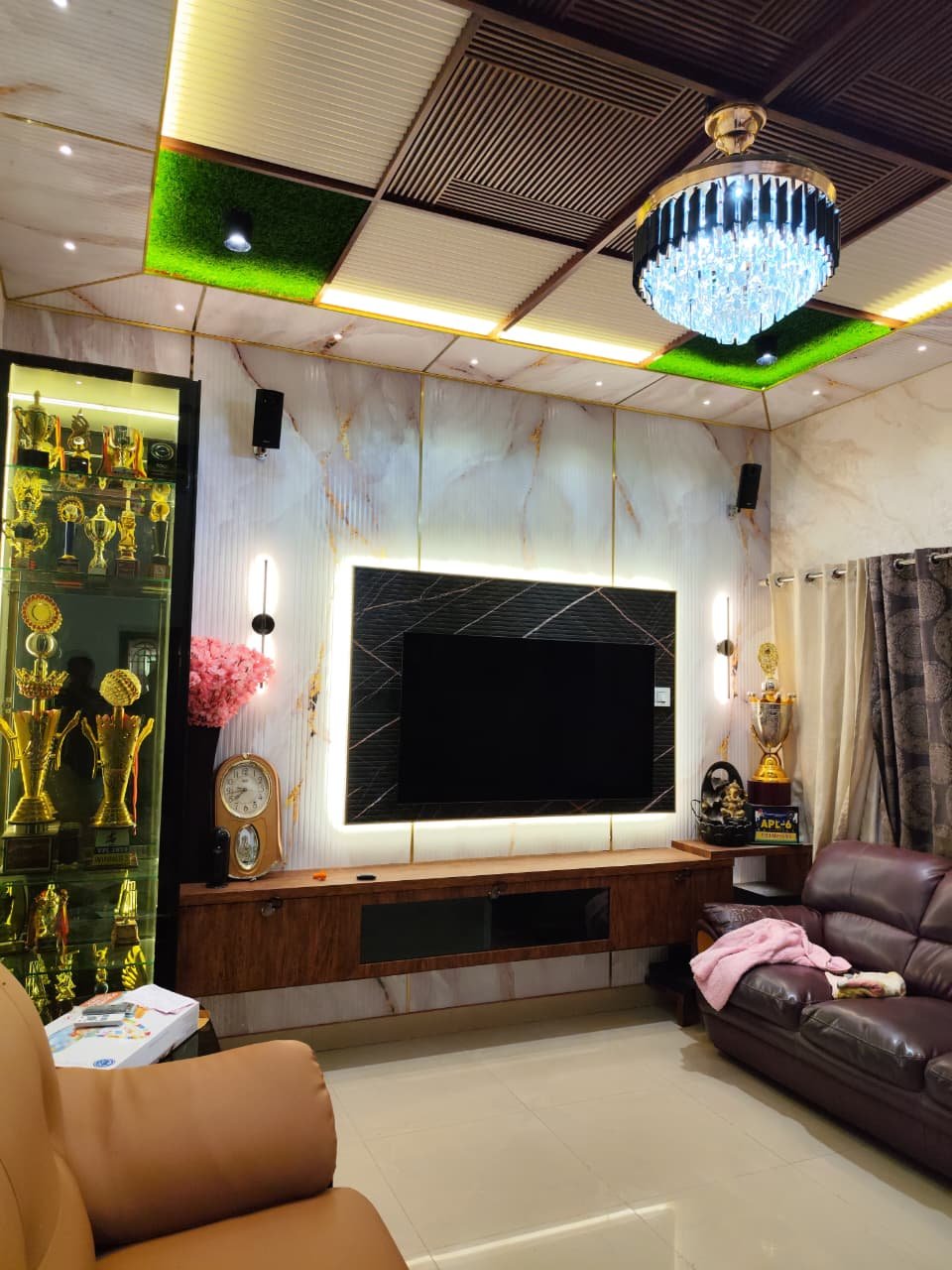 Luxury Living Room TV Wall with Marble Finish, aluminium interiors by Dhrithi Infra