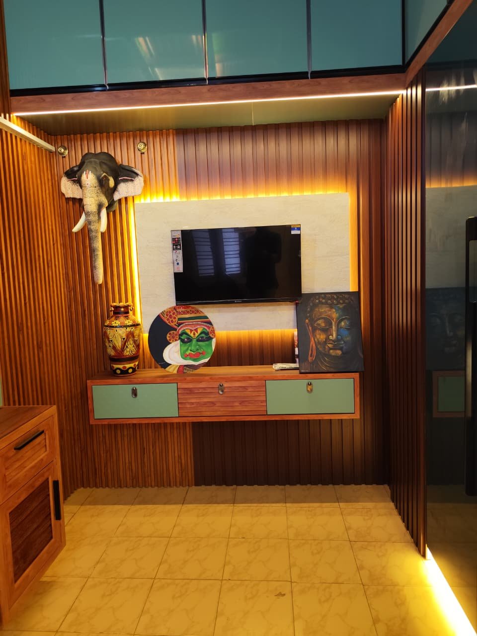 Luxury Wooden TV Wall Panel with Ambient Lighting, aluminium interiors by Dhrithi Infra