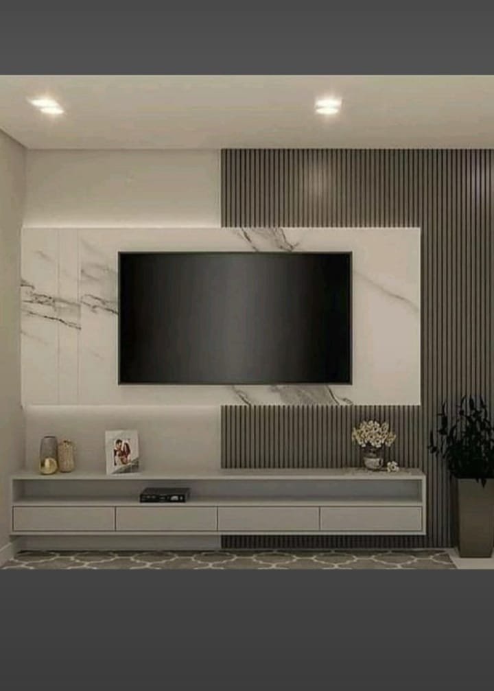 Minimal Marble TV Wall Design with Fluted Panels, aluminium interiors by Dhrithi Infra