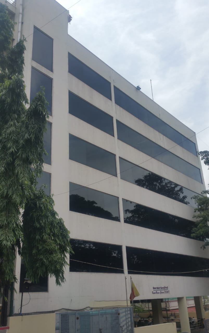 Modern Glass Facade Commercial Building, exterior works by Dhrithi Infra