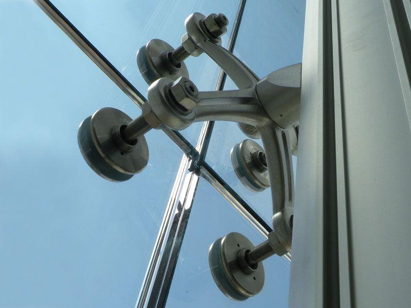 Spider fittings and routels for point fixed glass