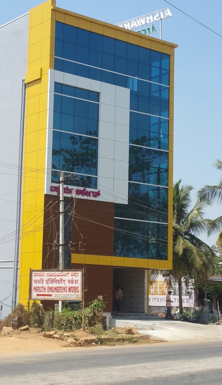 Yellow Accent Commercial Building Facade, exterior works by Dhrithi Infra