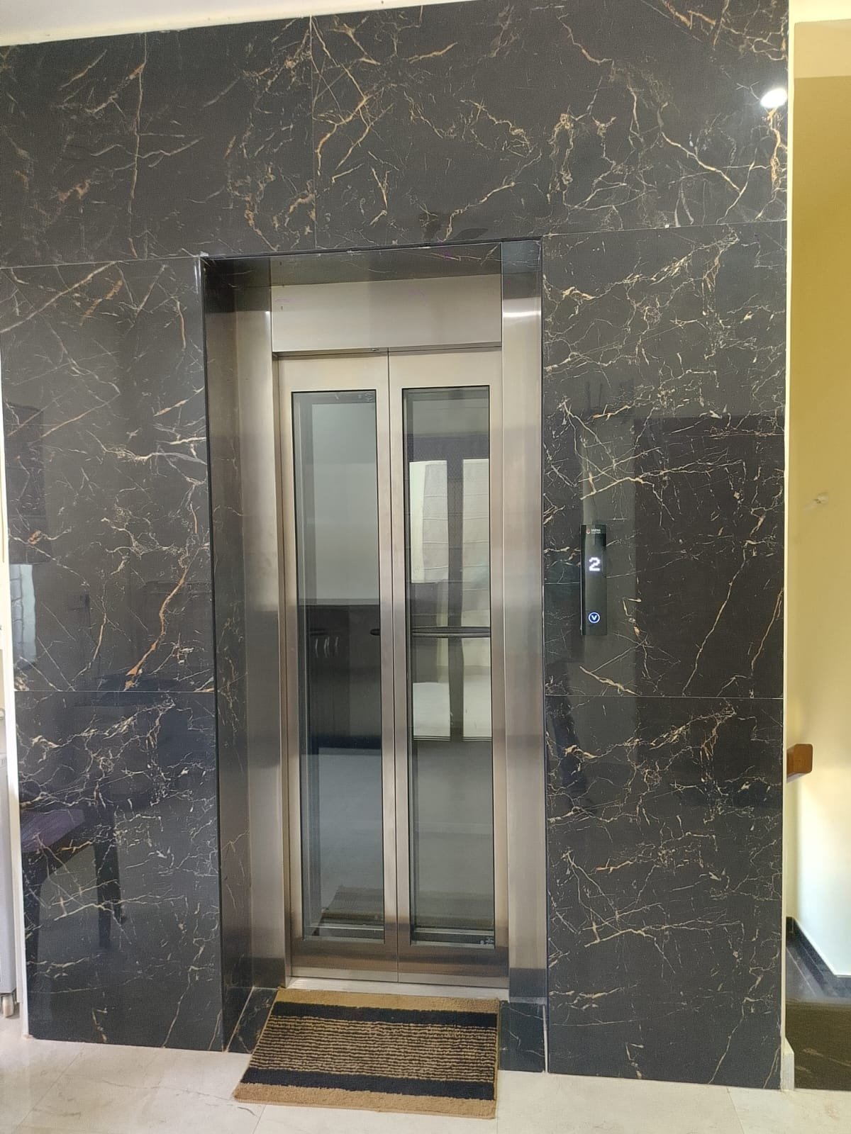 Luxury Villa Glass Elevator Granite Wall, home lifts by Dhrithi Infra